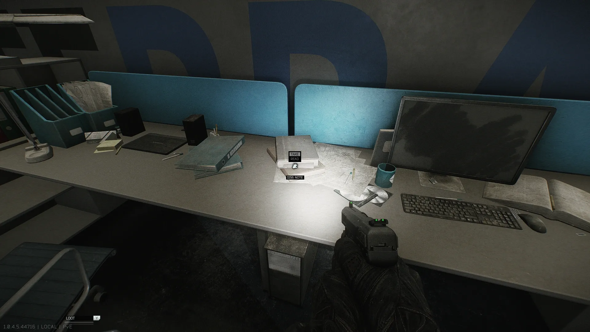 The note on the desk in the back right