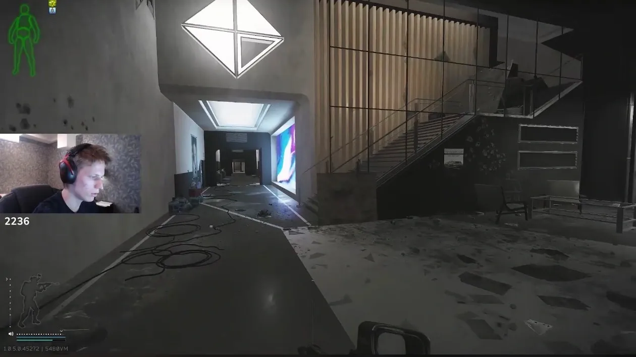 At the left side stairs of the main building