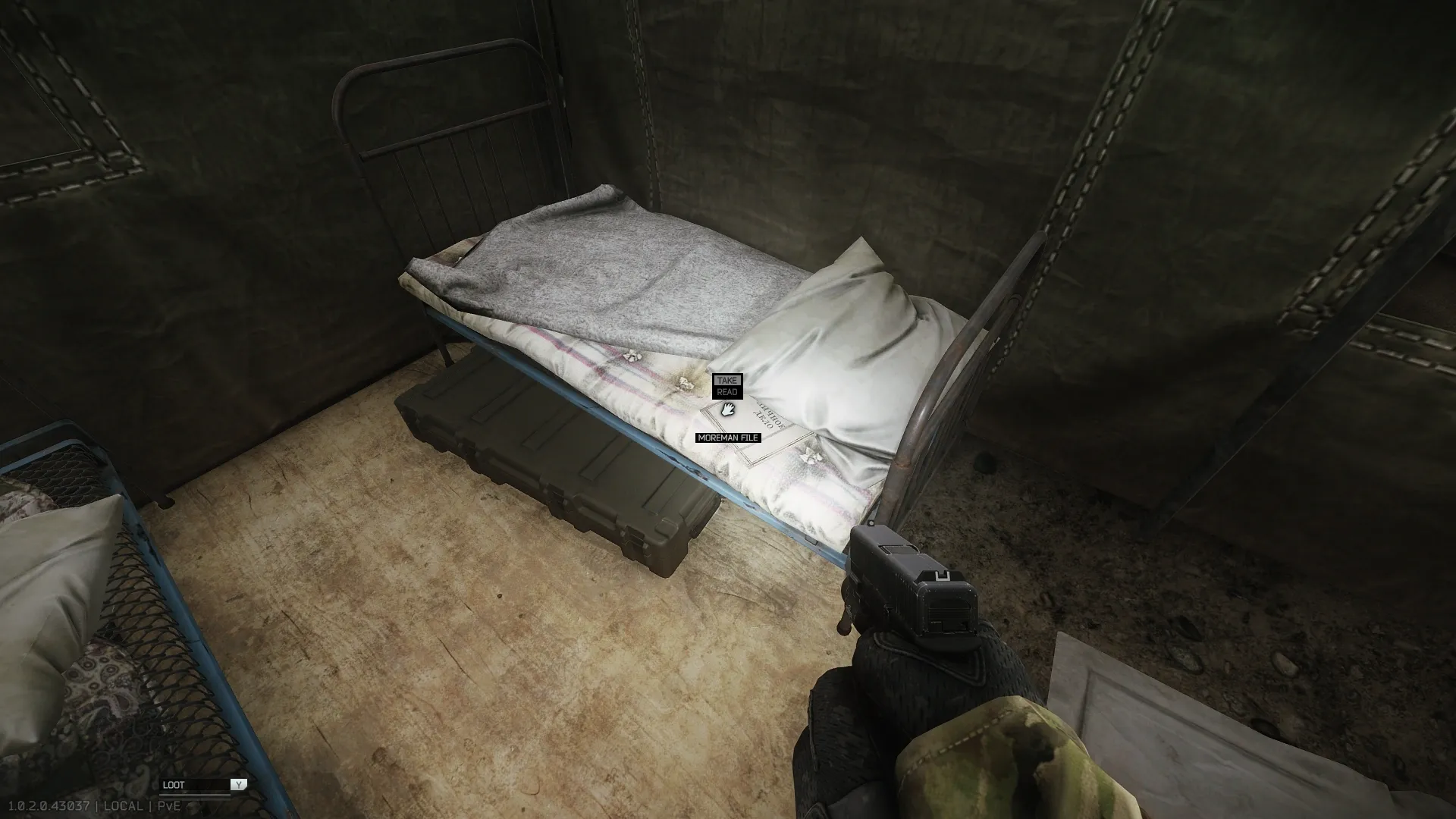 Moreman's personal file on one of the beds in the tent