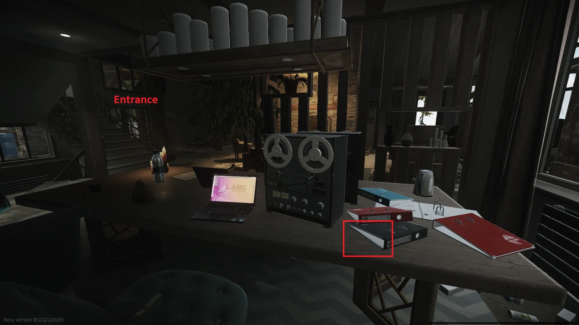 The documents are located in a black files folder on a desk to the right after you enter