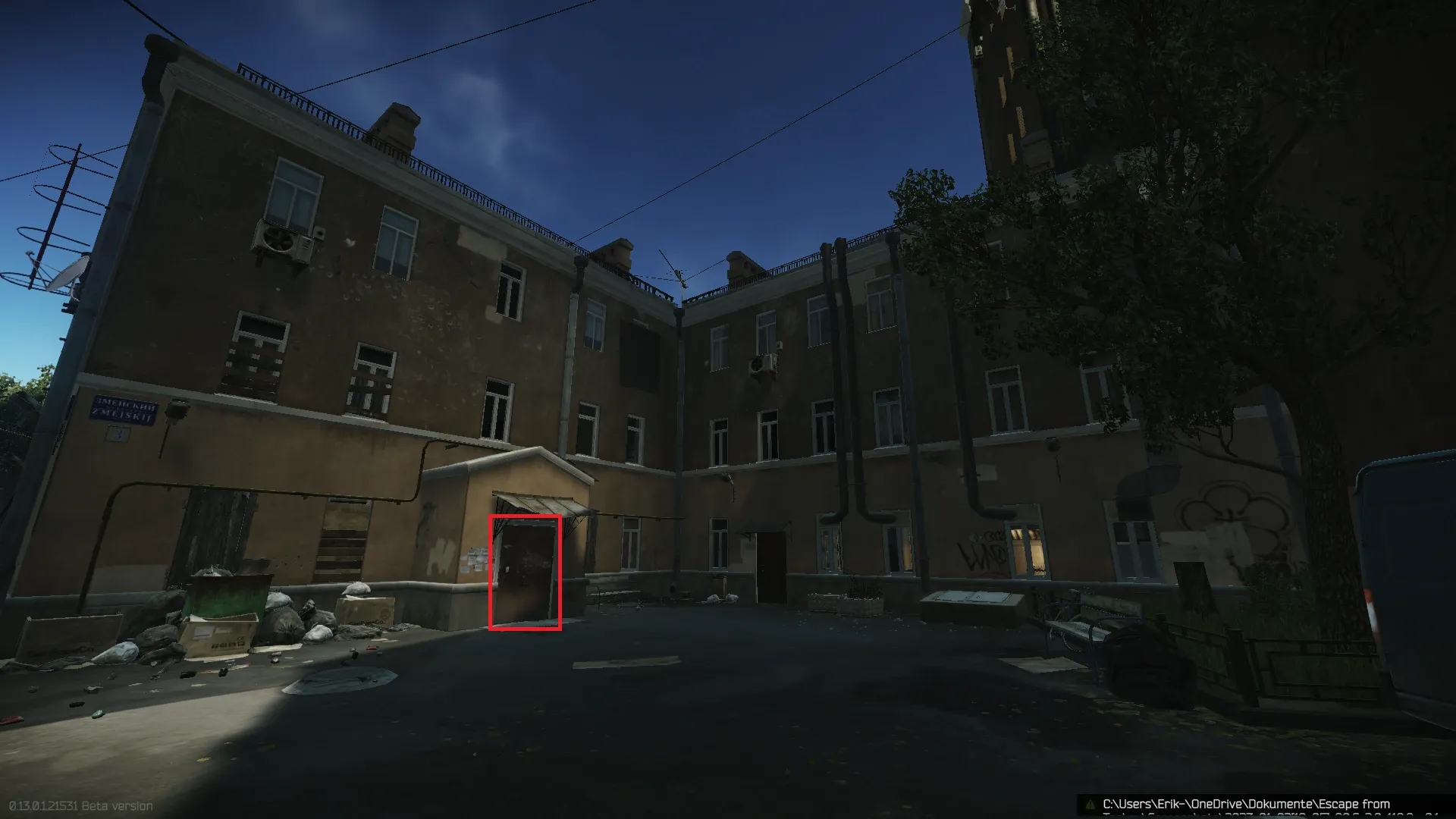 The building entrance is on the backyard side