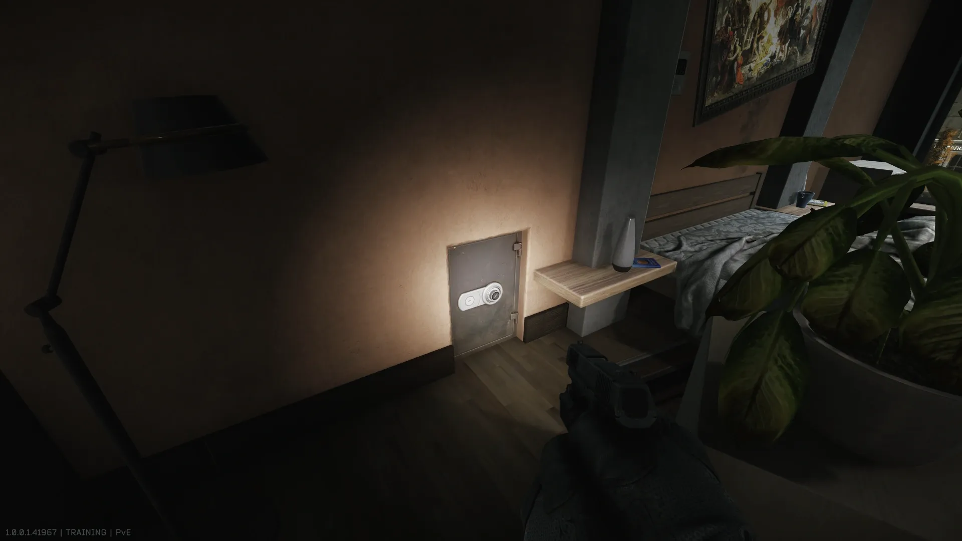 The safe with the keypad behind the painting