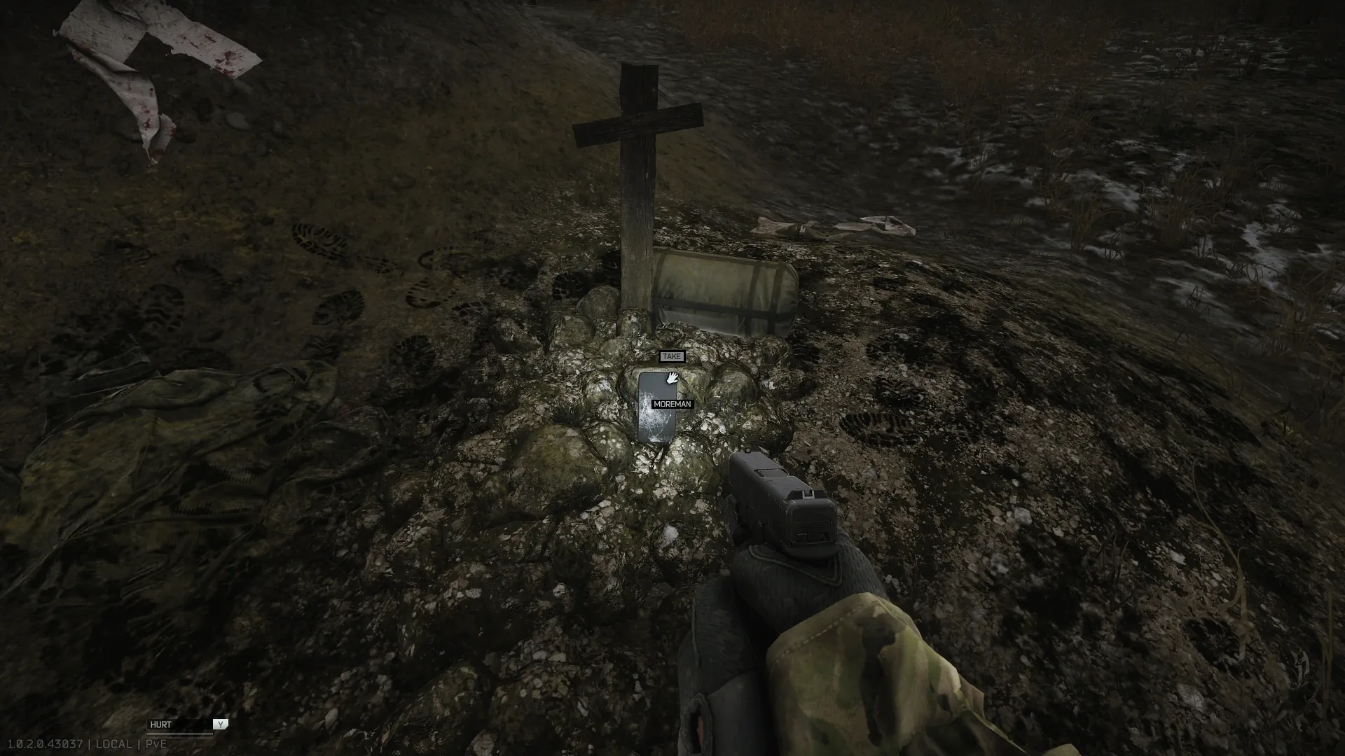 Moreman's phone on the ground next to the cross