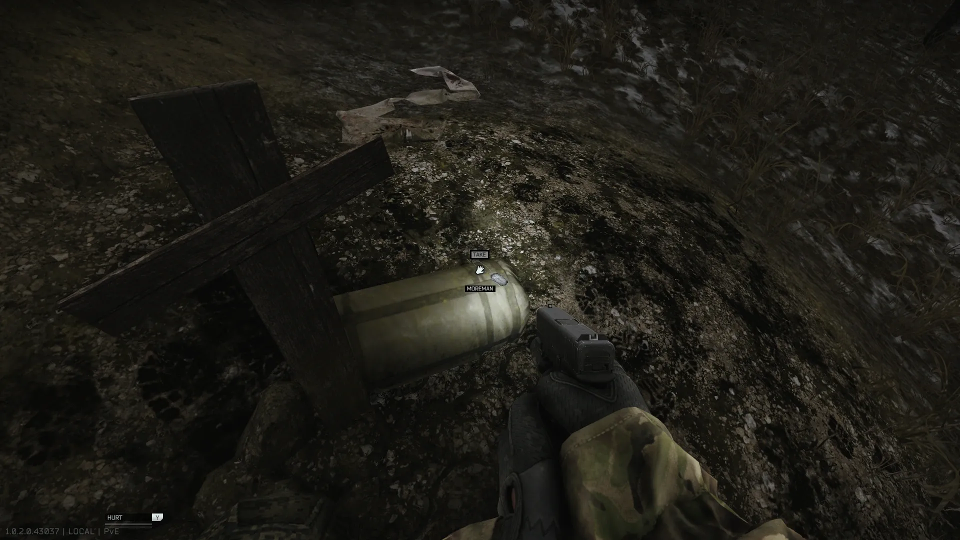 Moreman's dogtag on the sleeping bag next to the cross