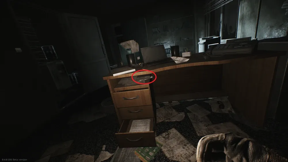 Docs 0022 is under the desk, on top of the drawers