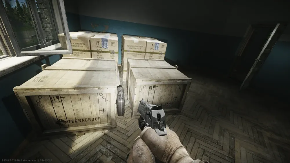 2: In the storage room, on the floor between the wooden crates