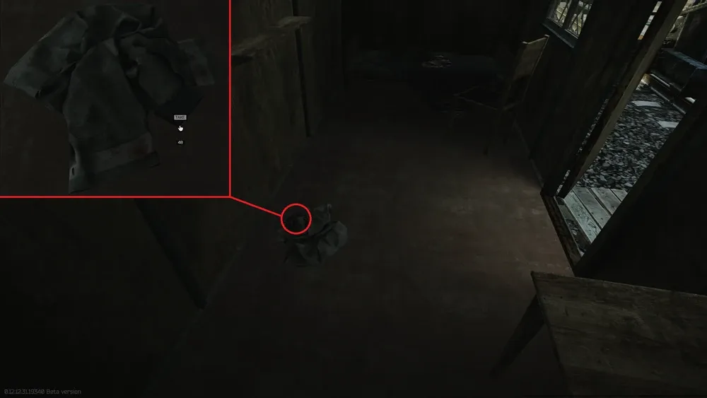 The folder is located under a jacket on the floor
