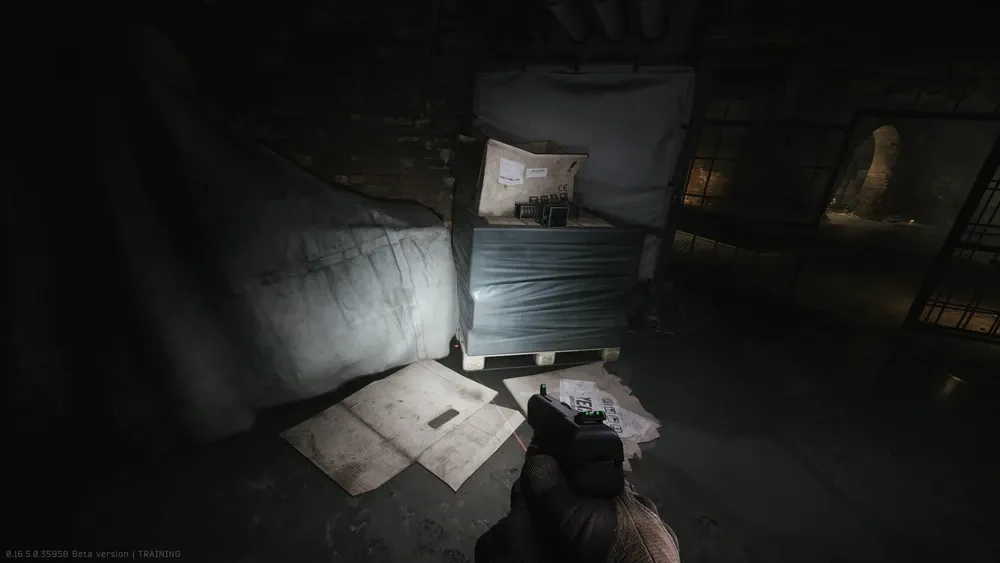 9: Next to the pallet near the grate door