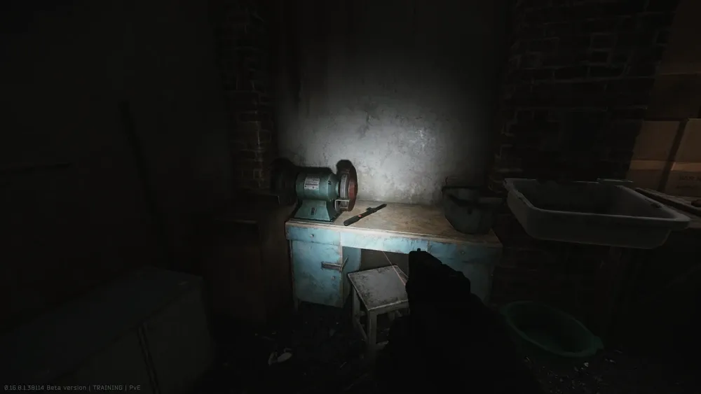 Third spawn in building #4: On the desk with the bench grinder next to the sink